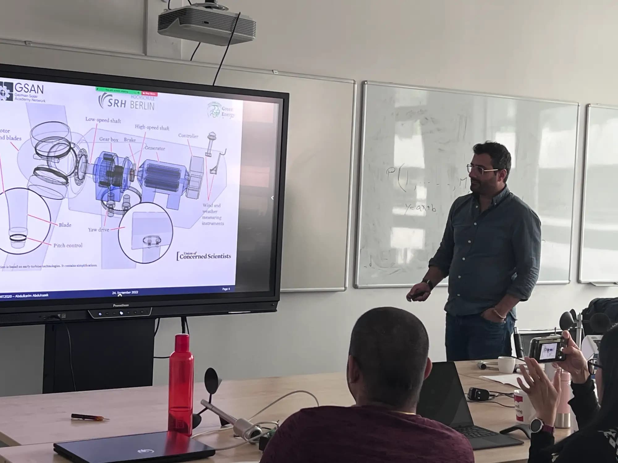 Professor explaining how a wind turbine works